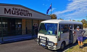 Izzy the bus in front of the Channel Museum sign in the Huon Valley region Tasmania